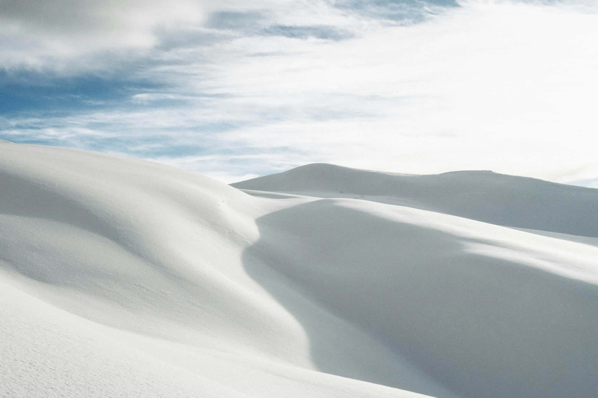 Serene Snowscape Undulating Hills Wallpaper