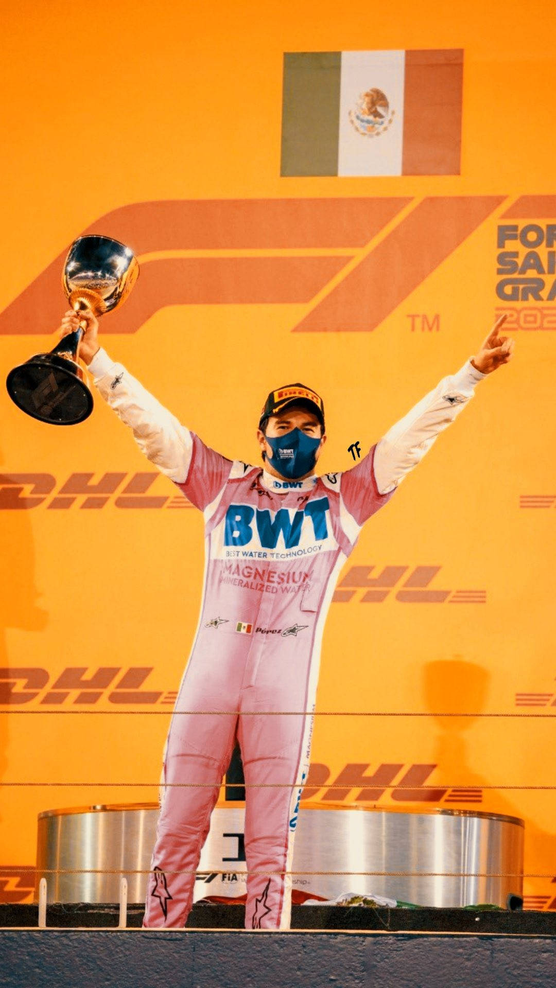 Caption: "Champion Driver Sergio Perez Proudly Holding a Trophy" Wallpaper