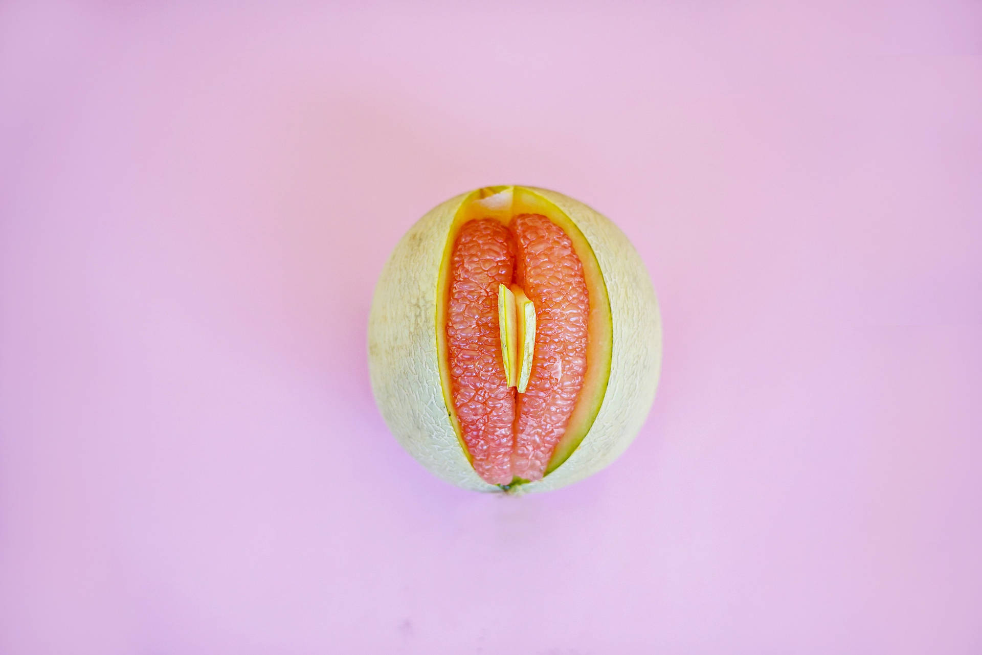 Artistic Representation of Sexual Symbol using Pomelo Fruit Wallpaper