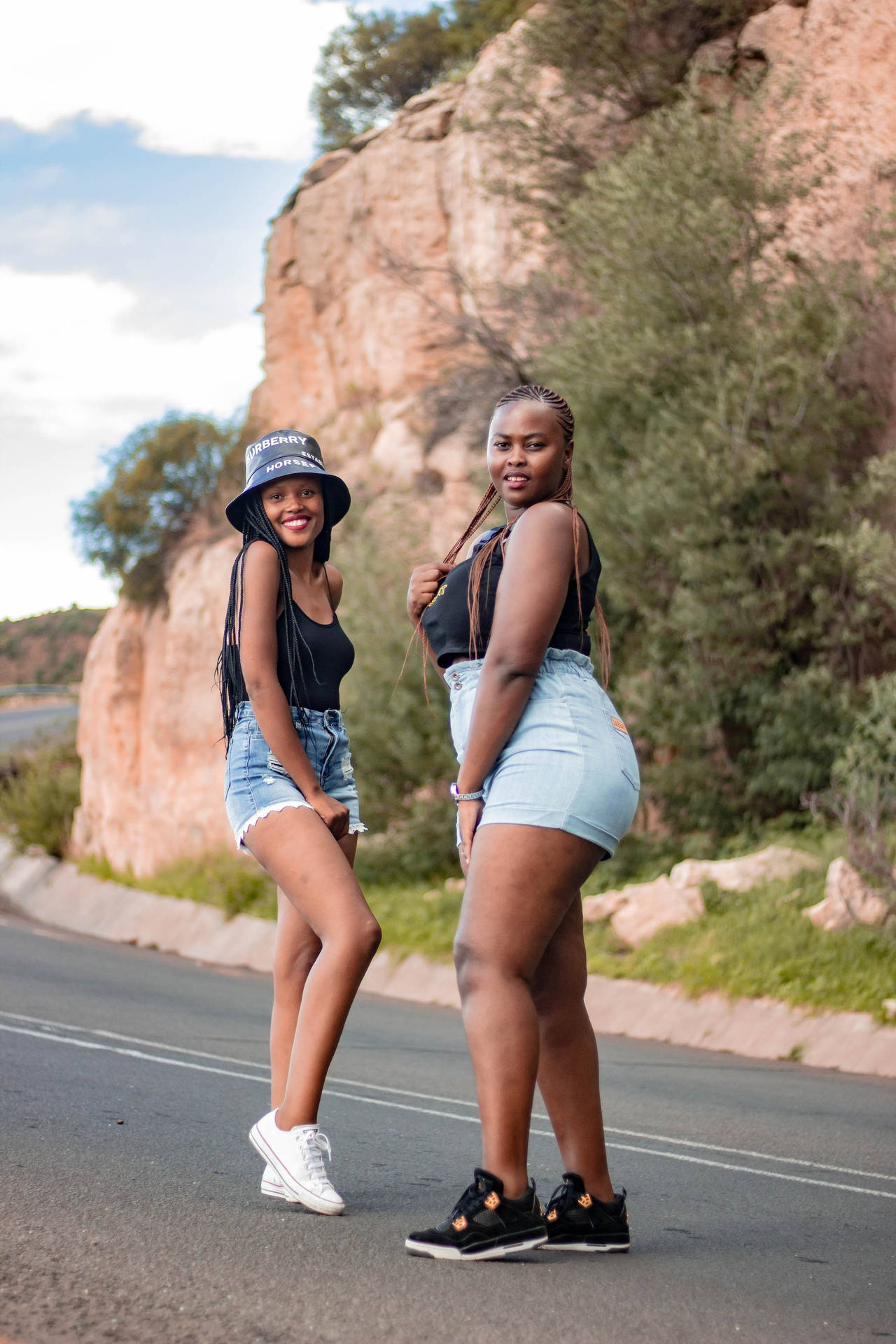 Sexy Black Women On The Road Near Mountain Wallpaper