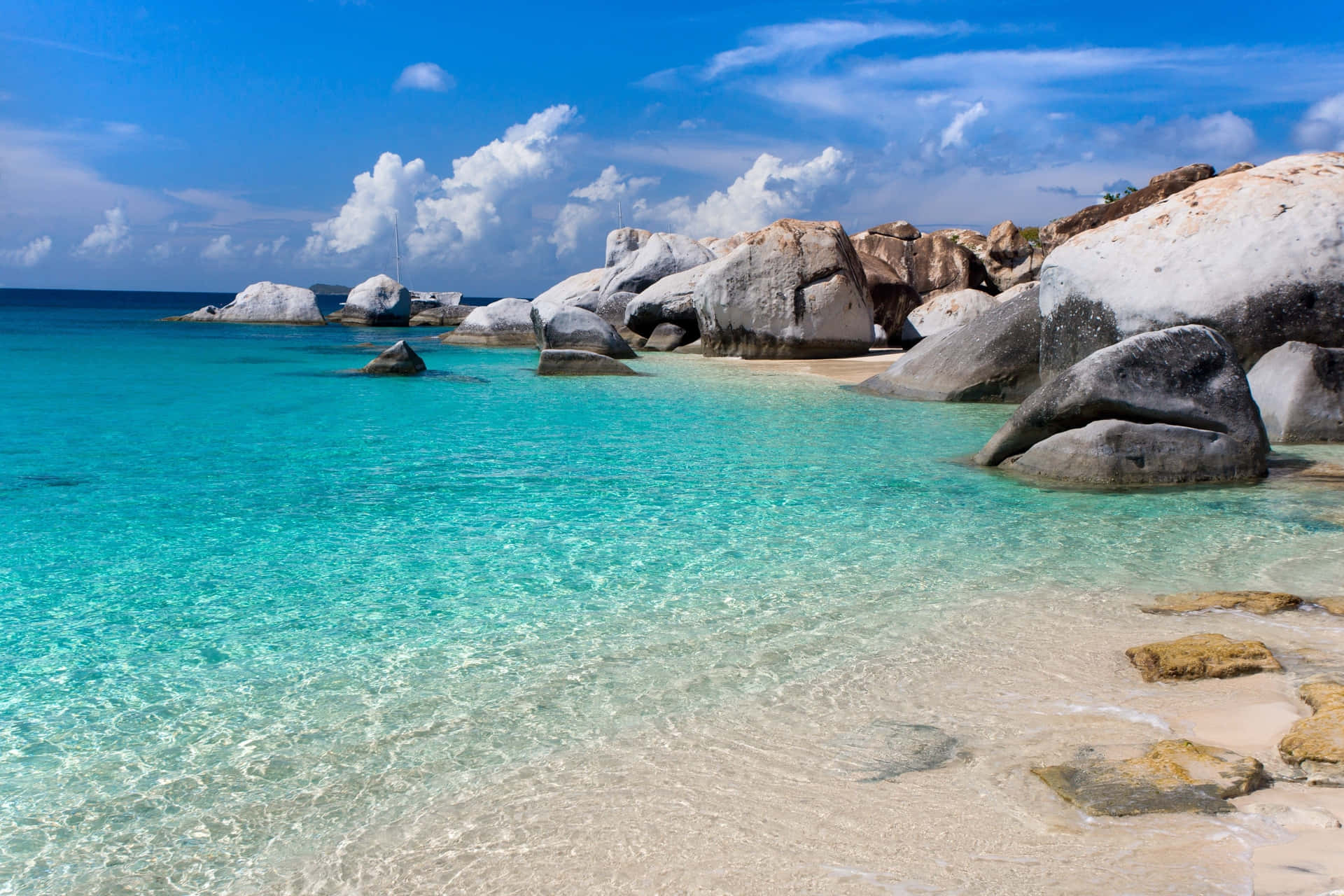 A serene Seychelles Beach with crystal clear waters and soft, sandy shores. Wallpaper