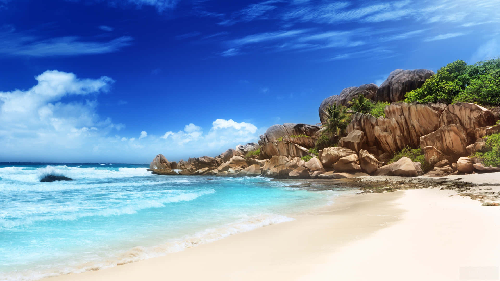 Serene Seychelles Beach with Crystal Clear Water Wallpaper