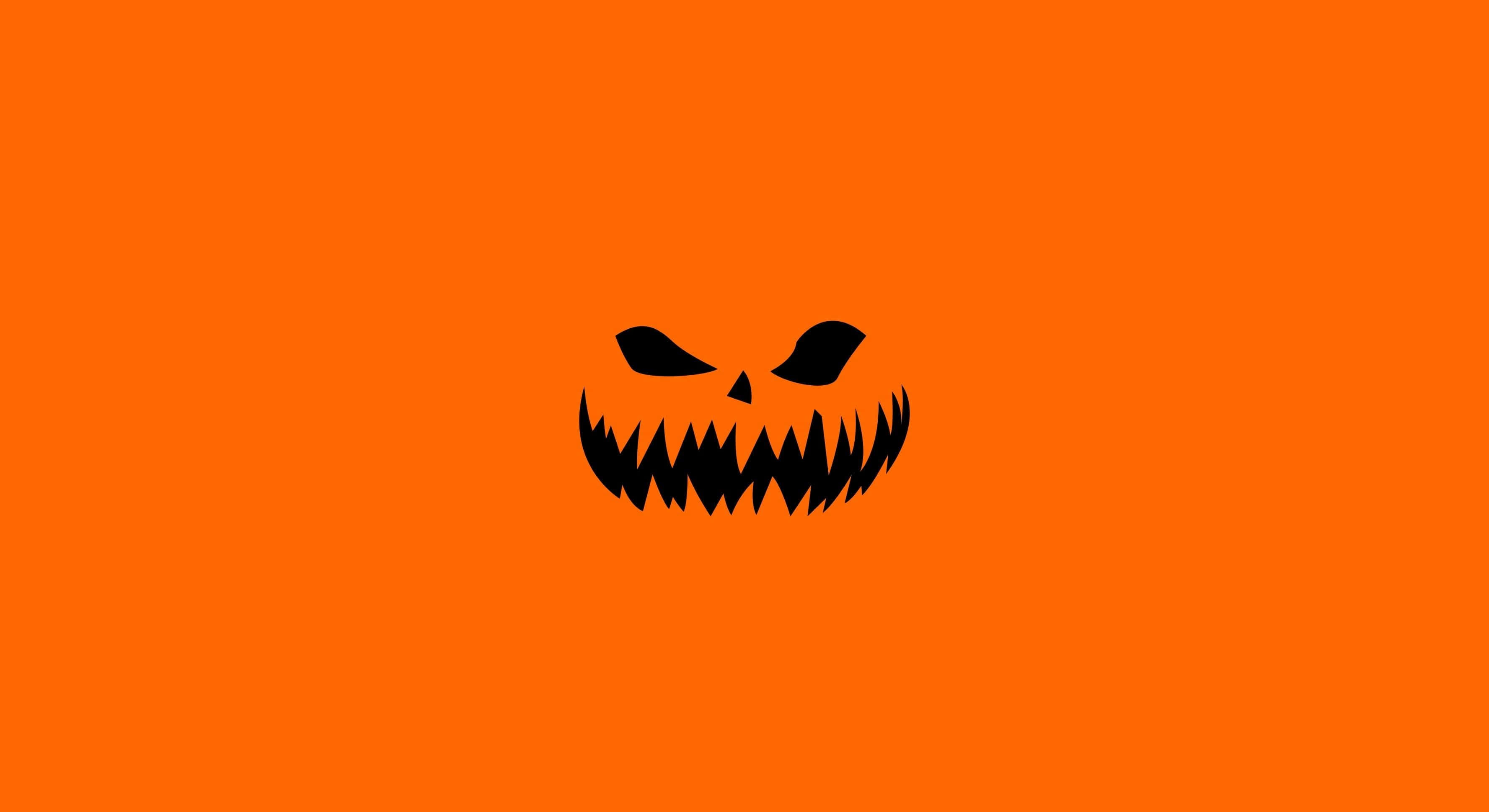 Sfondospaventoso Di Halloween Arancione
