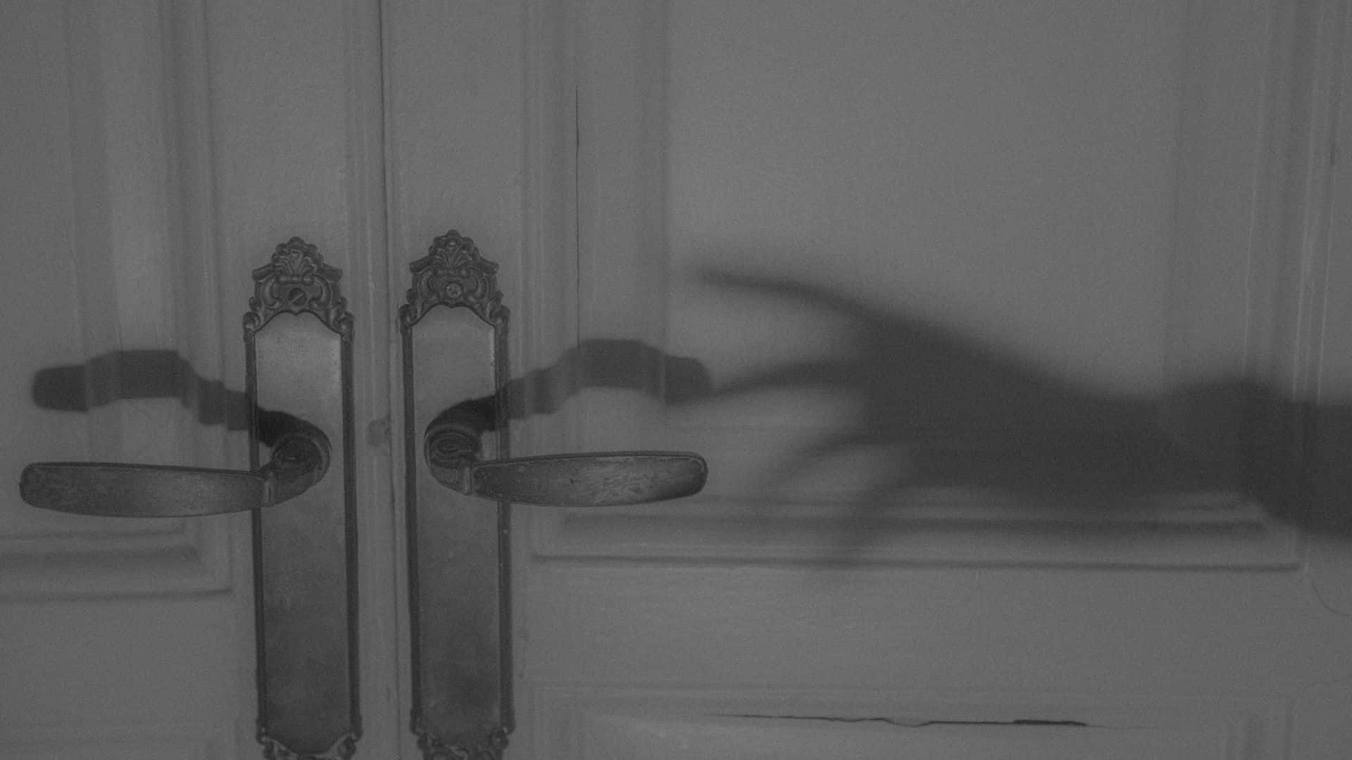 Shadowy_ Hand_at_ Door_ Horror_ Aesthetic.jpg Wallpaper