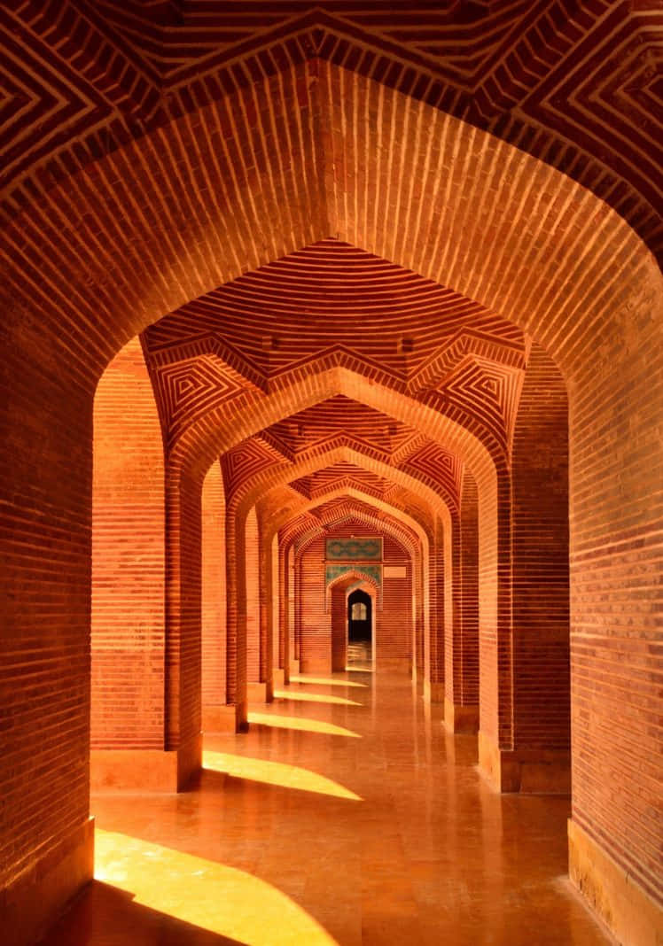 Majestic Pillar of Shah Jahan Mosque at Golden Hour Wallpaper