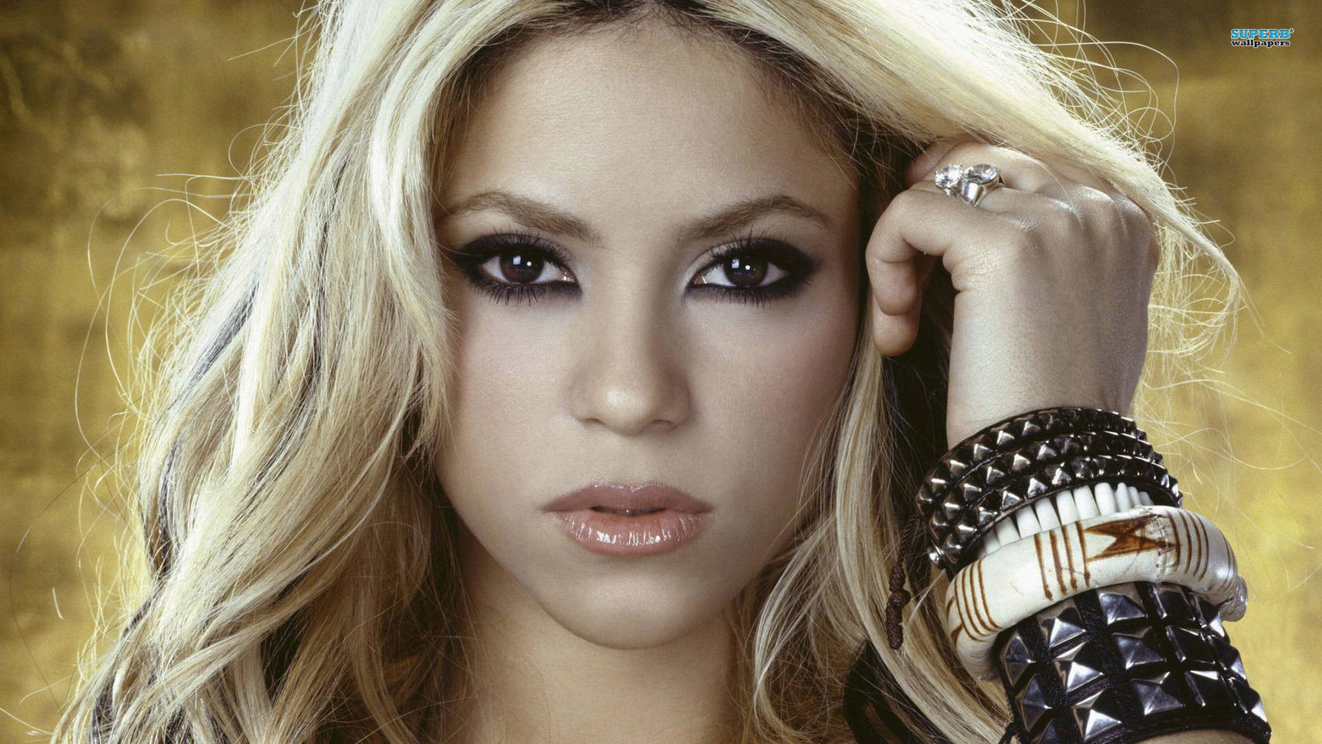 Award-winning Pop Artist, Shakira, donning a stylish Black Bracelet Wallpaper