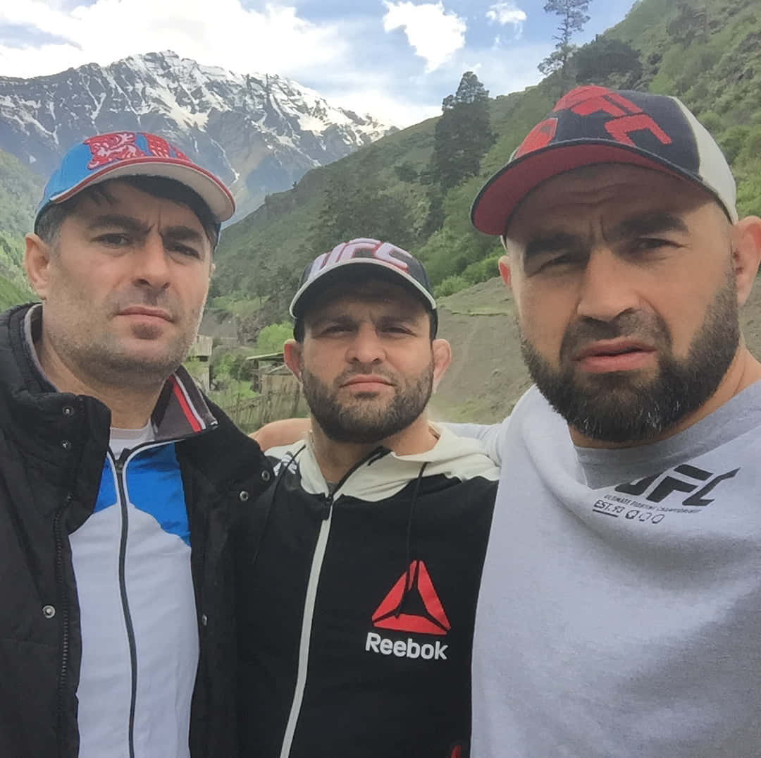 Shamil Abdurakhimov And Friends Wearing Caps Background