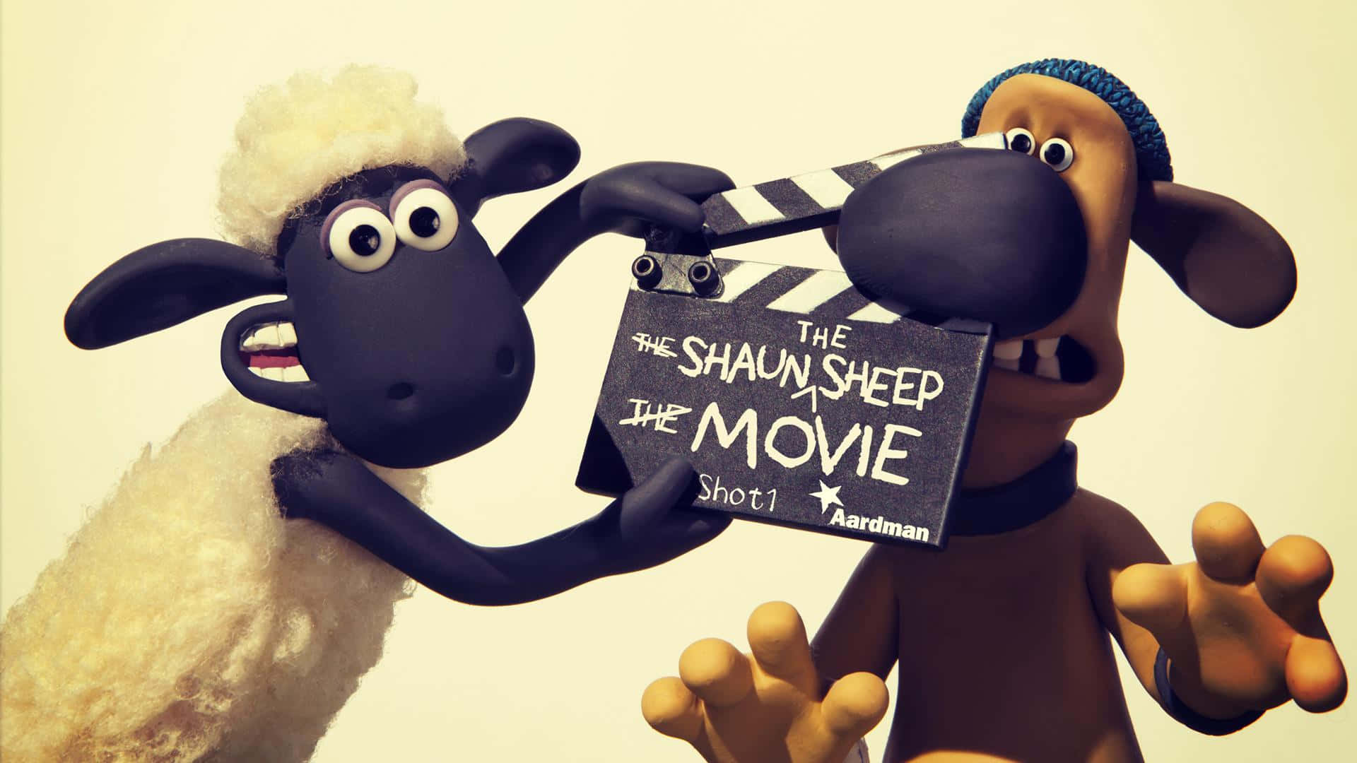 Shaunthe Sheepand Bitzerwith Clapperboard Wallpaper