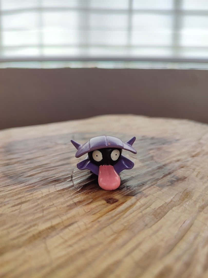 Shellder Toy On Table Wallpaper