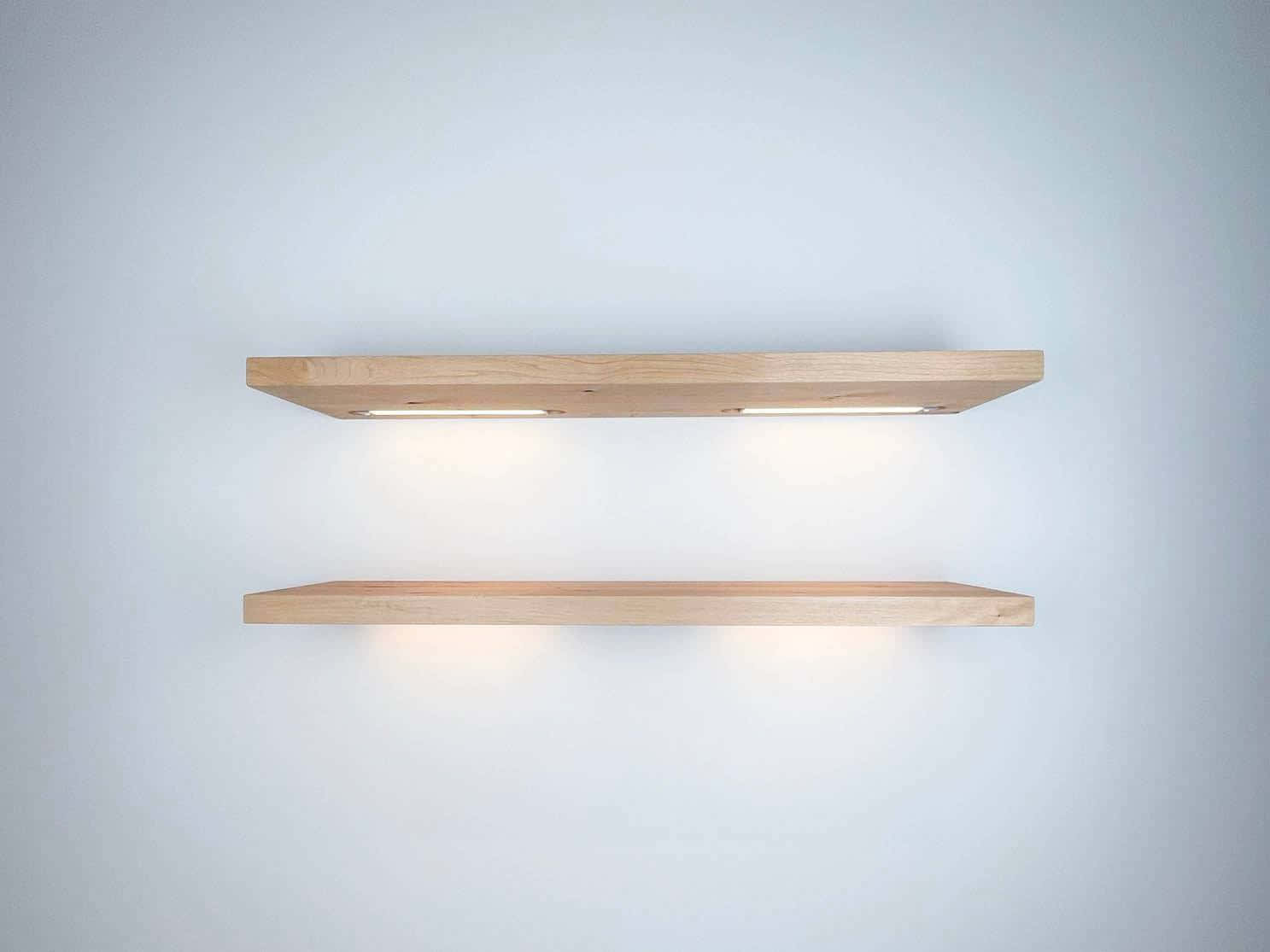 Two Wooden Shelves With Lights On Them