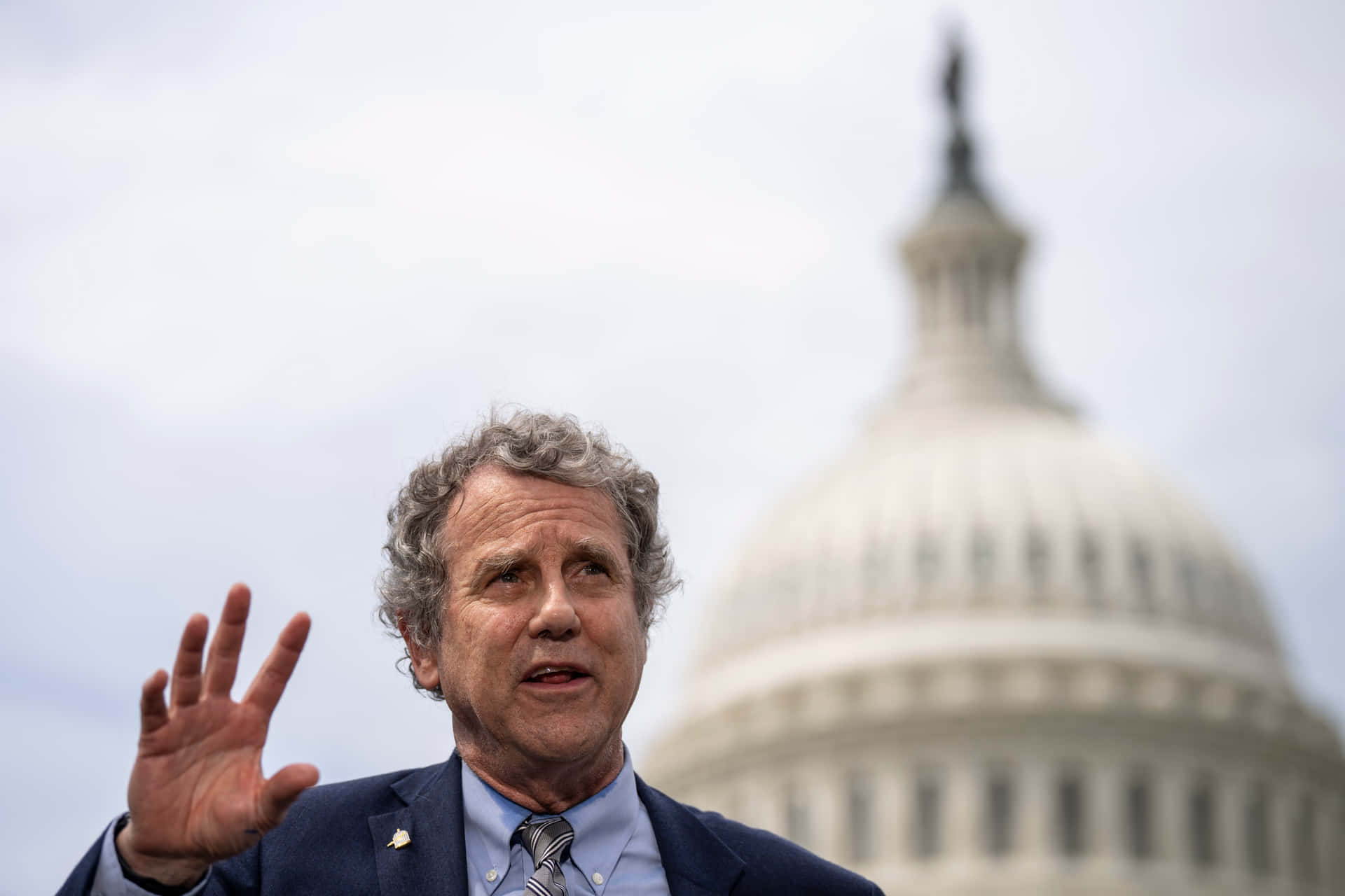 Sherrod Brown Speech Before The Capitol Background