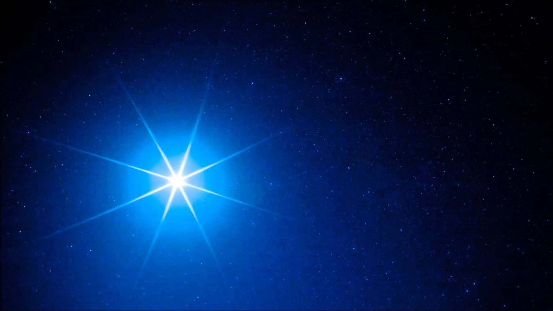 Enblå Stjerne På Himlen Med En Stjerne I Midten.