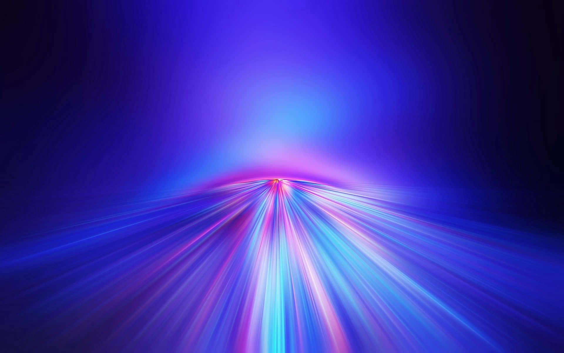 A Blurry Image Of A Blue Light Moving Through A Dark Background