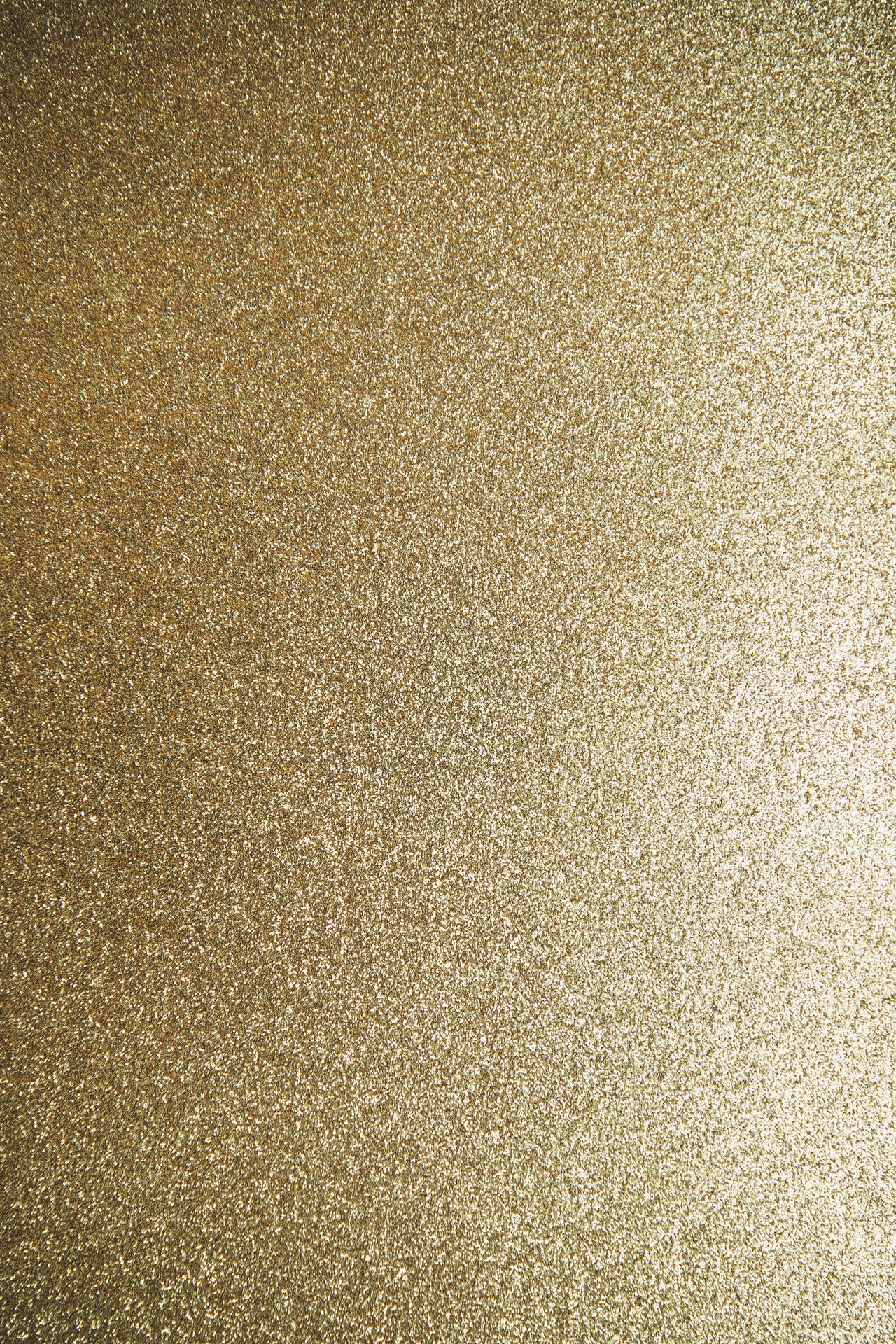 Glinsende guld glitter står frem på sort. Wallpaper