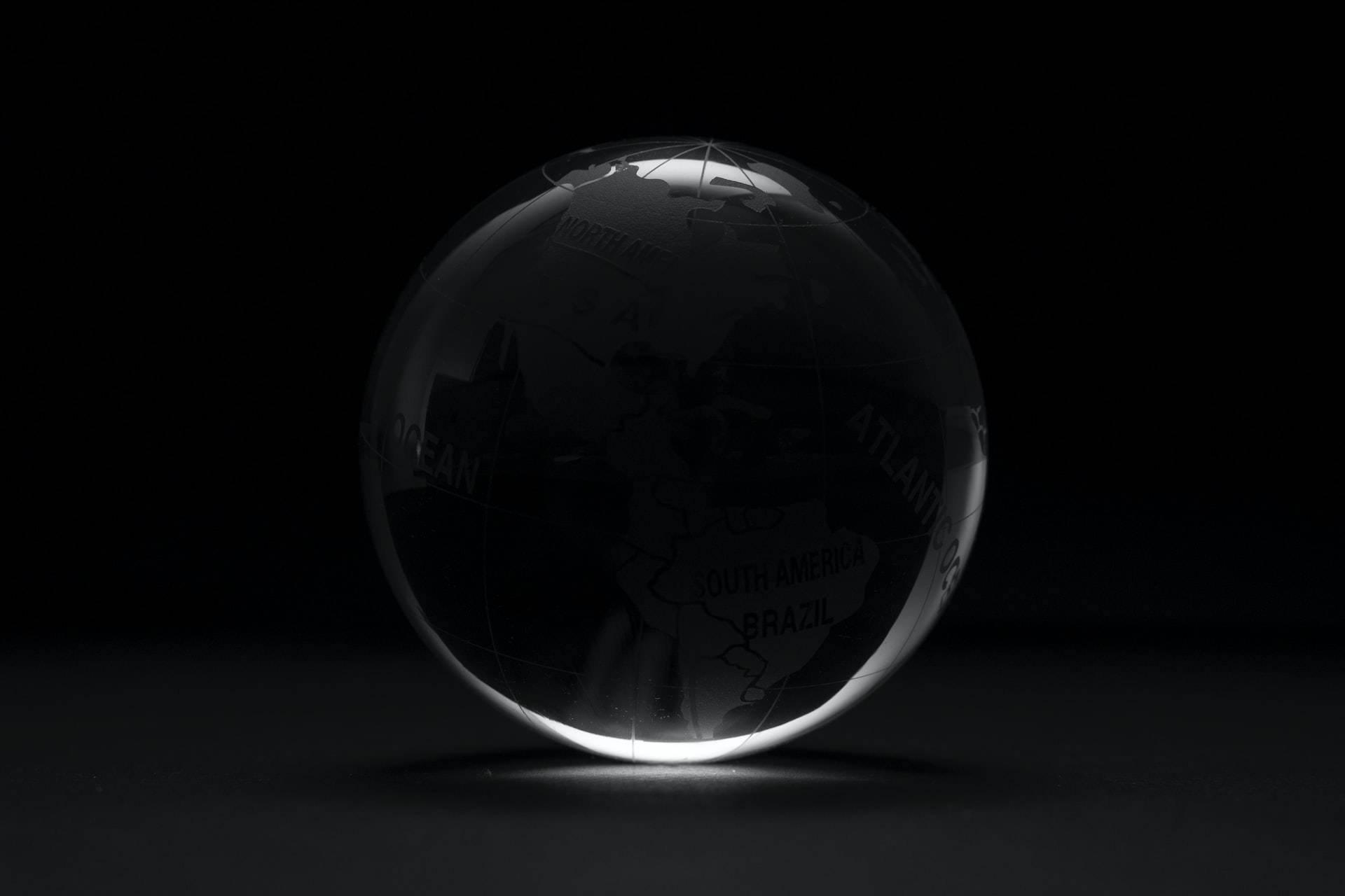 Shiny Globe On Black Tablet Wallpaper