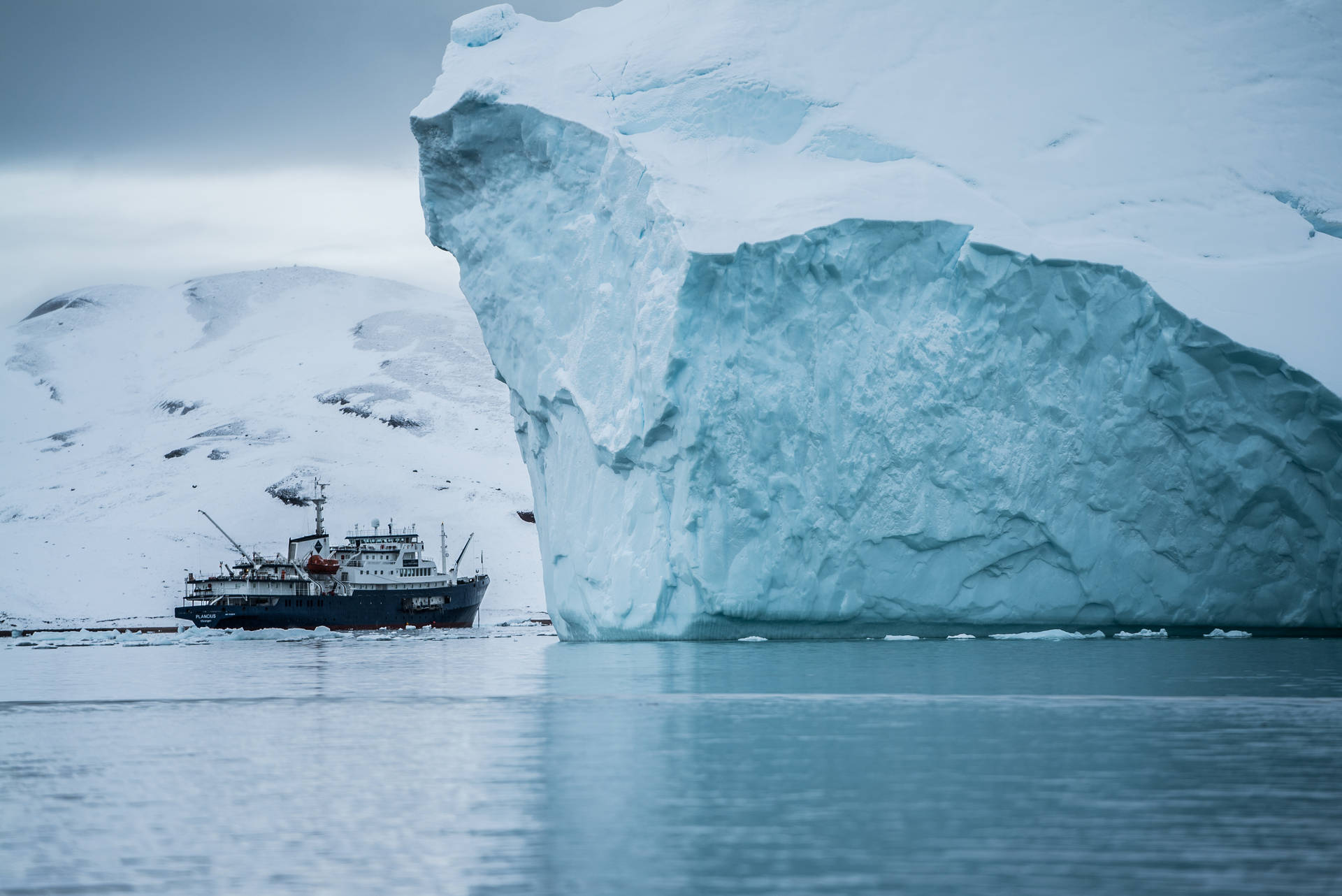 Ship Near Greenland Iceberg