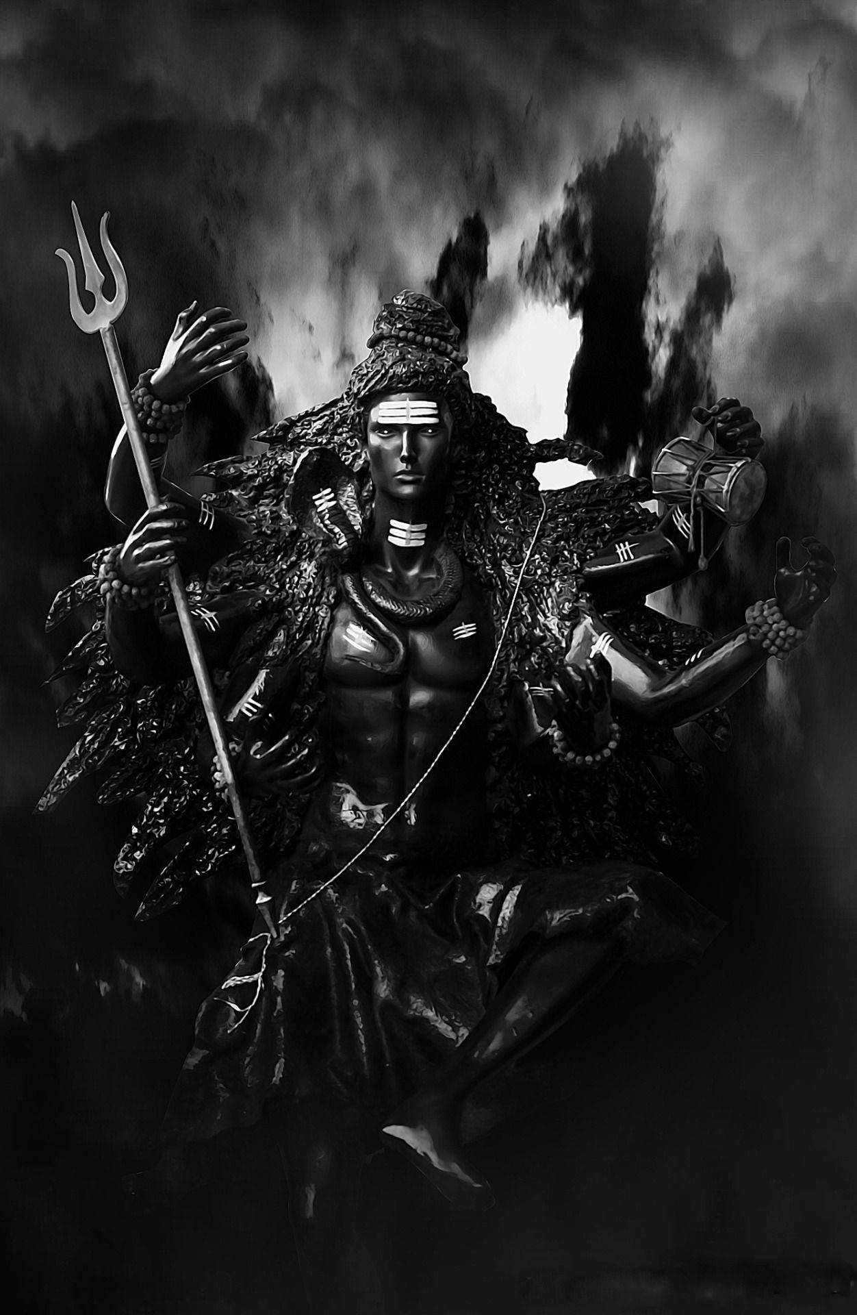 Estatuaesculpida De Shiva Negro De Cuatro Brazos. Fondo de pantalla