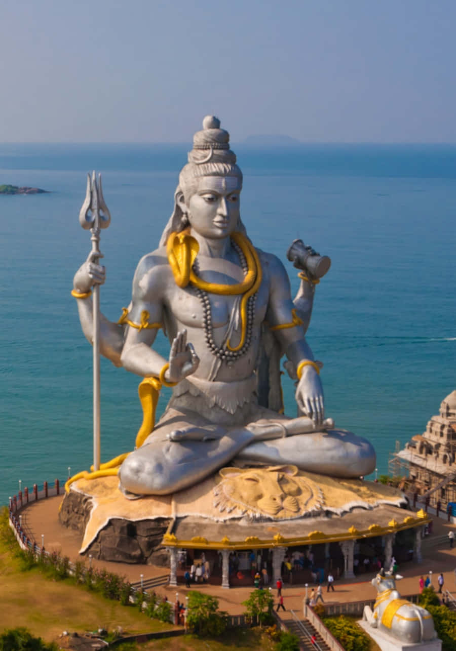 Download A Large Statue Of Lord Shiva Sitting On Top Of A Hill ...