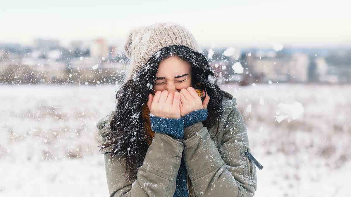 Shivering Woman Covering Mouth [wallpaper] Wallpaper