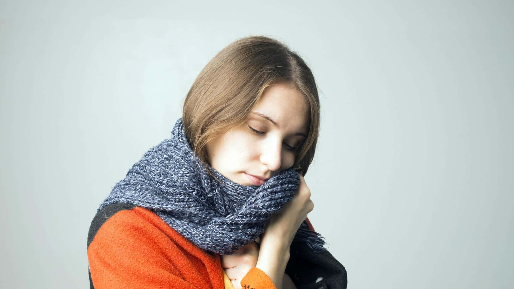 Shivering Woman Holding Scarf [wallpaper] Wallpaper