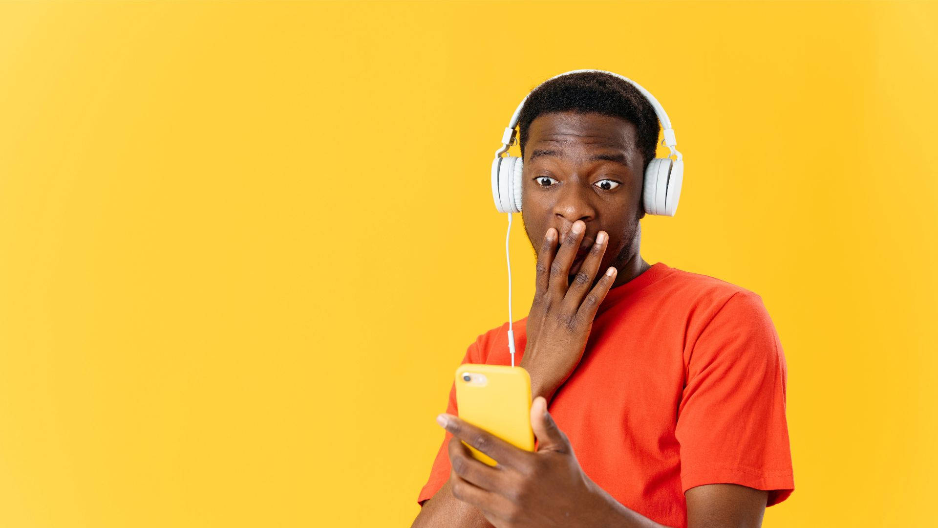Shocked African Man Listening Music Wallpaper