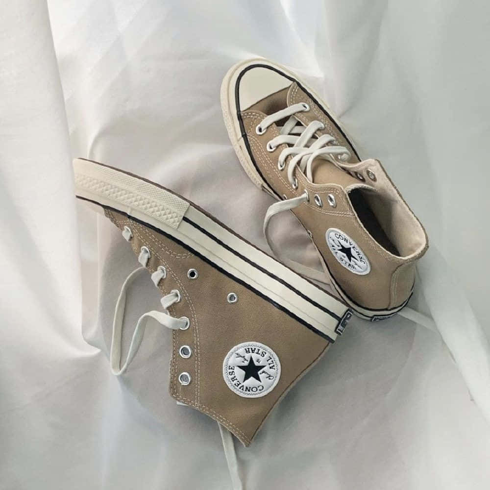 A Pair Of Converse High Tops On A White Sheet