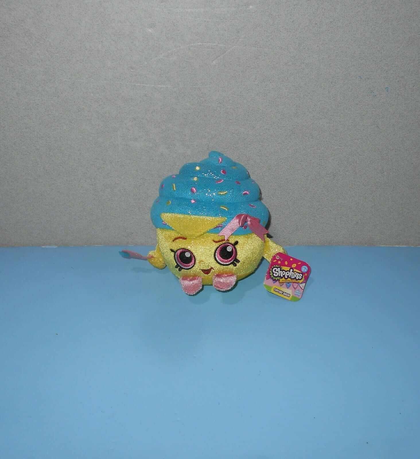 A colorful and adorable collection of Shopkins characters on a pink background