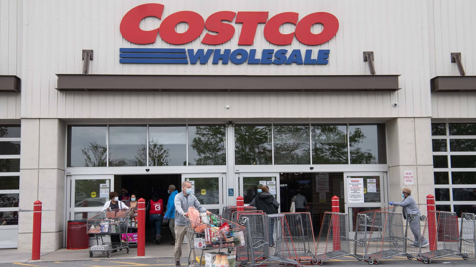 Shoppers Pushing Carts Costco Wholesale Wallpaper