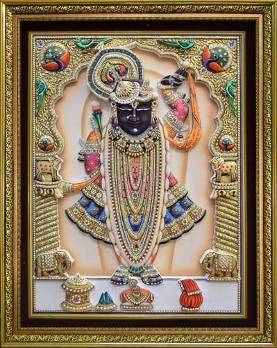 Majestic Image of Shrinathji Amidst Golden Beads and Pillars Wallpaper