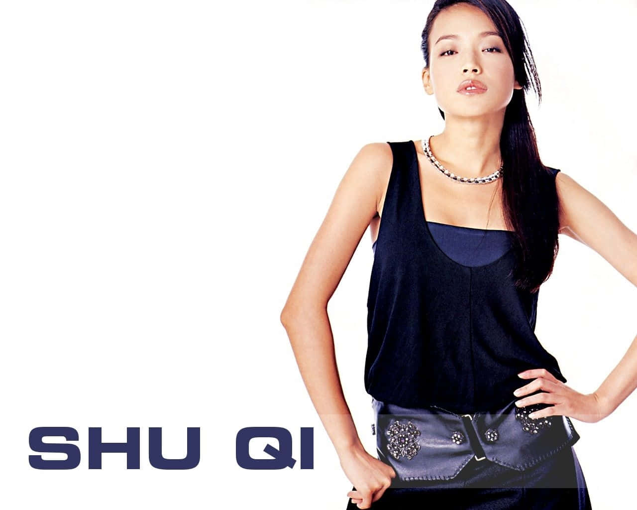 Shu Qi posing elegantly in a photoshoot for a magazine Wallpaper