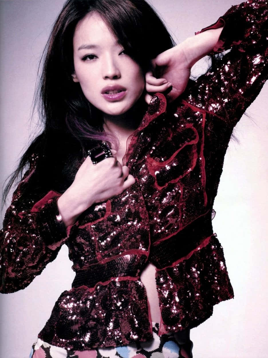 Shu Qi posing elegantly in a photo shoot Wallpaper