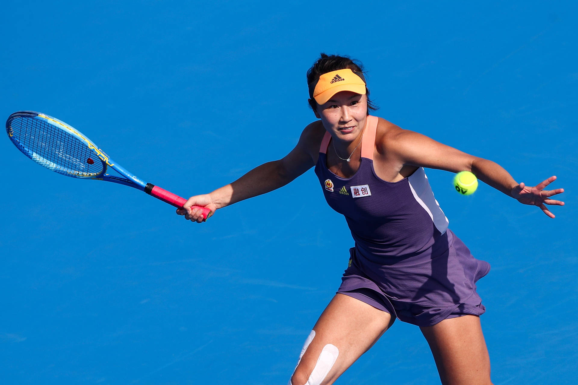 Shuai Peng Playing Tennis Blue Wallpaper