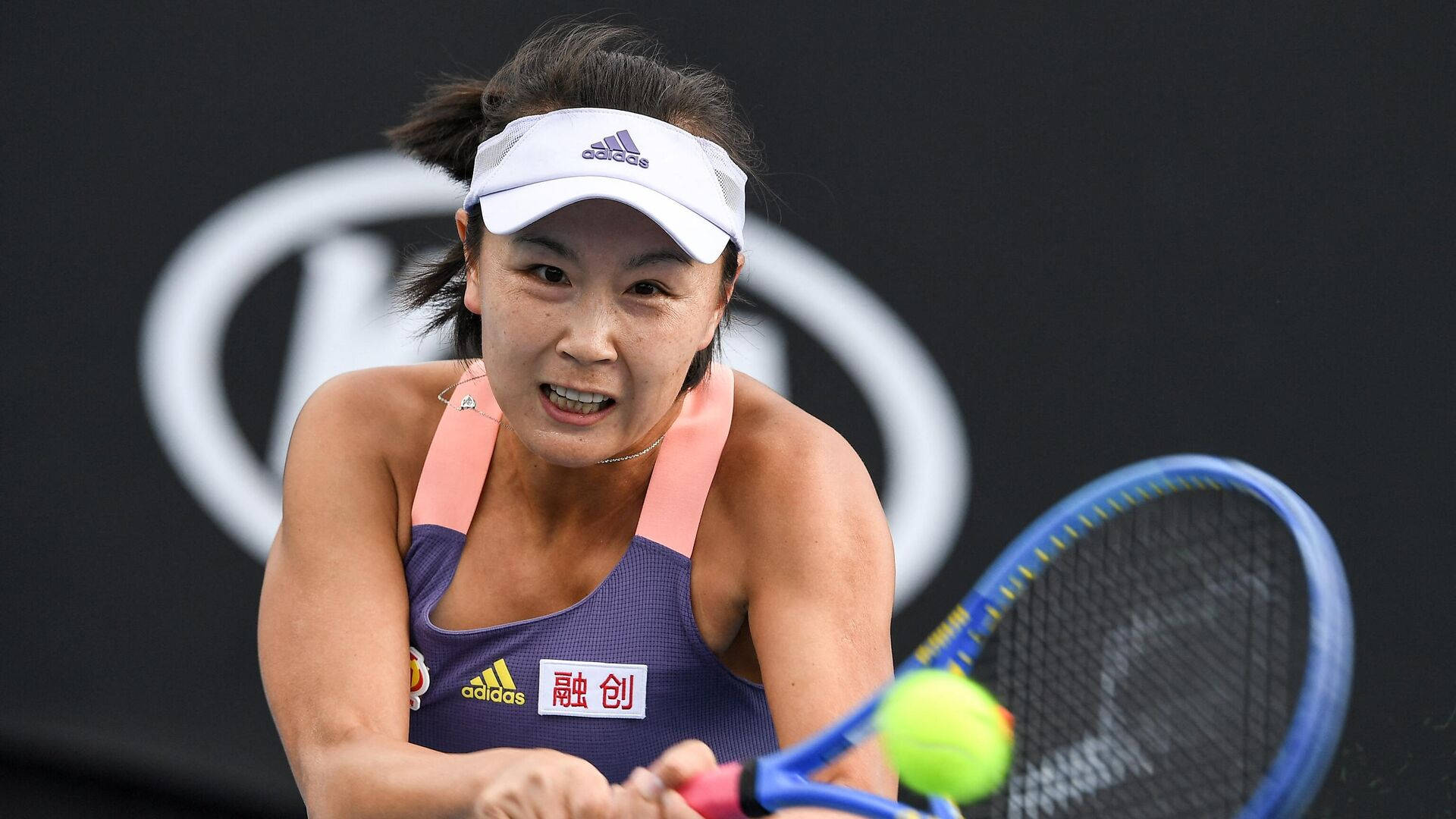 Shuai Peng Powerfully Smashing a Tennis Ball Wallpaper