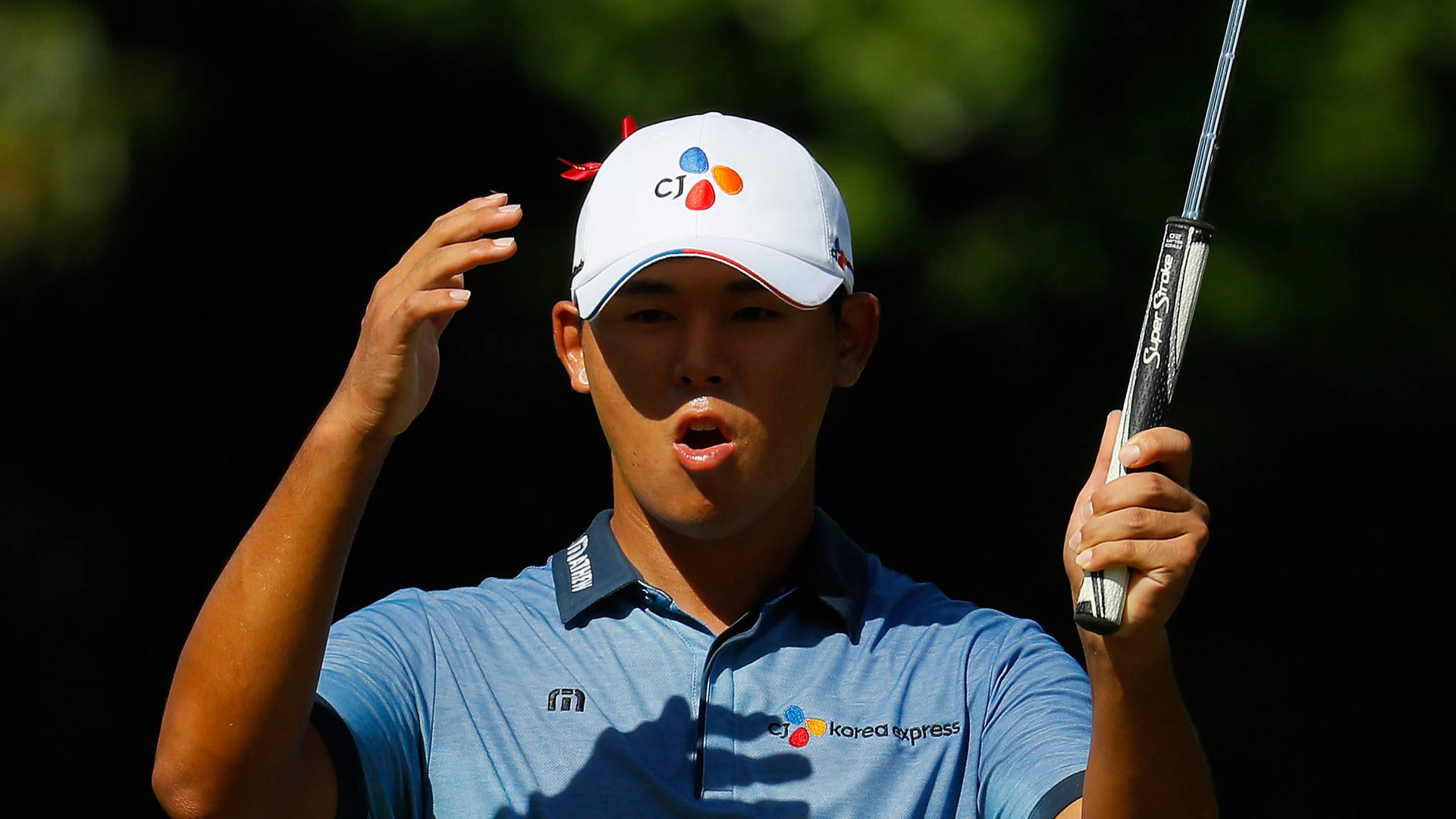 Pro Golfer Si Woo Kim Showing a Shocked Expression Wallpaper