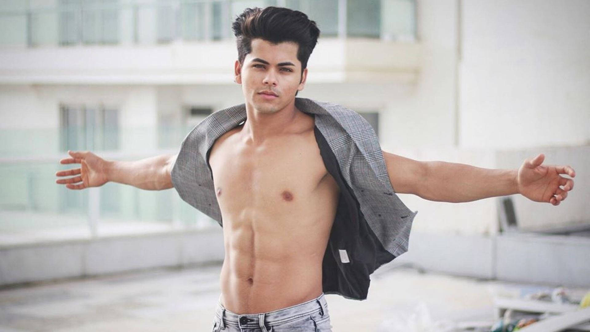 Siddharth Nigam Arms Open Wallpaper