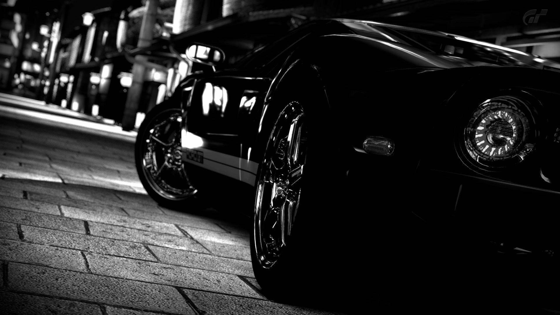 Side-angle Of Black Sports Cars Wallpaper