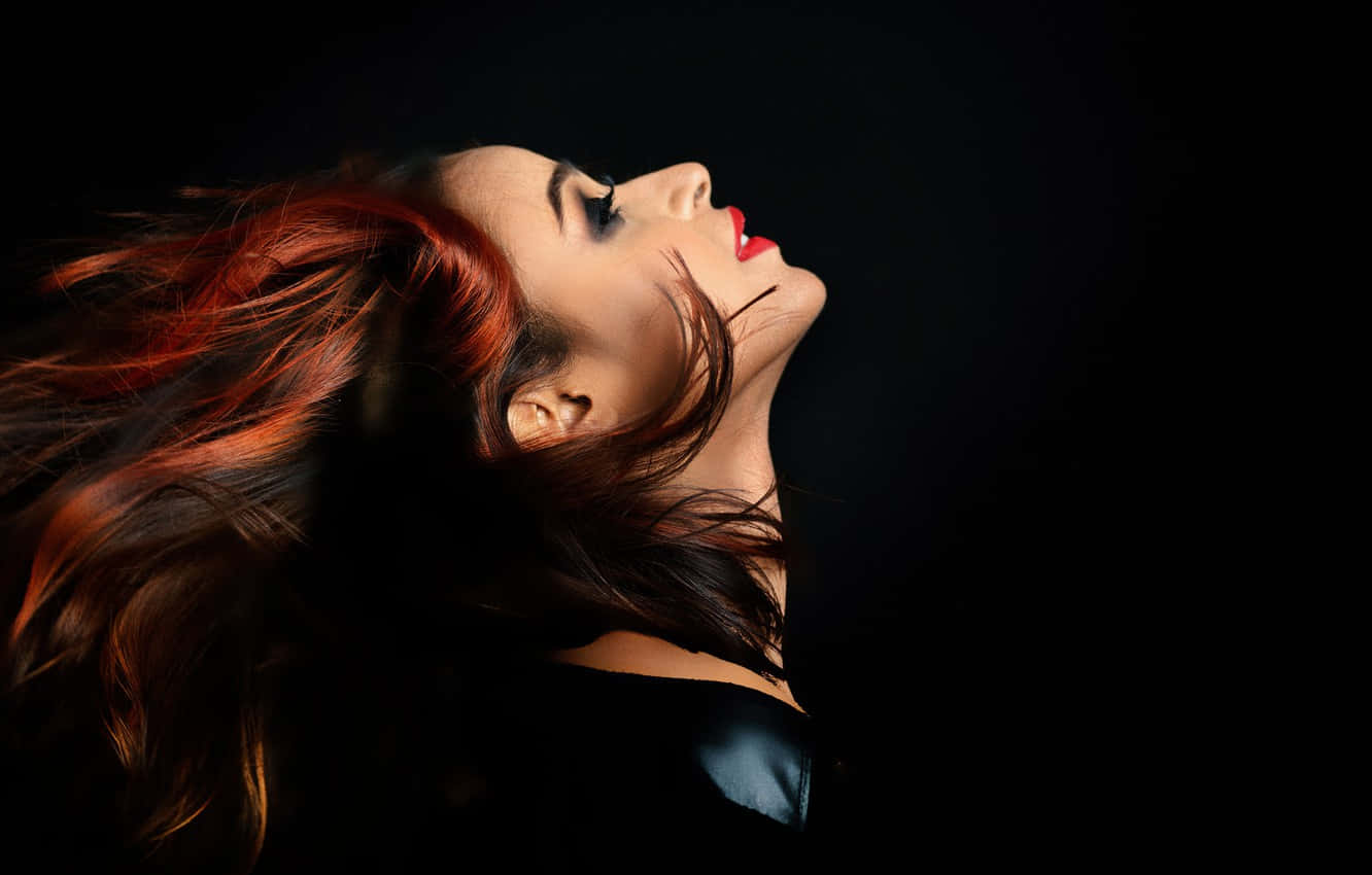 Side Profile Model's Flowing Red Hair Wallpaper
