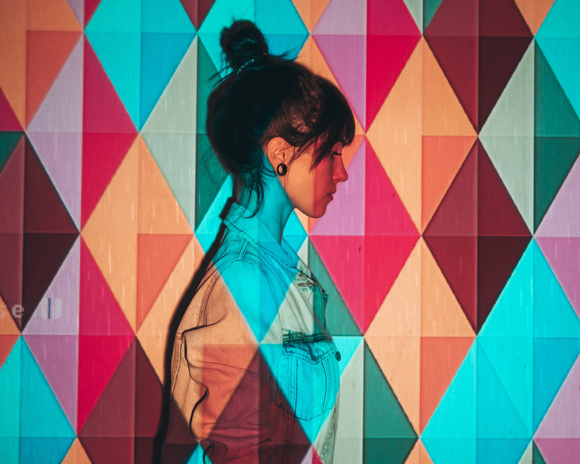 Side Profile Of Woman In Colorful Background Wallpaper