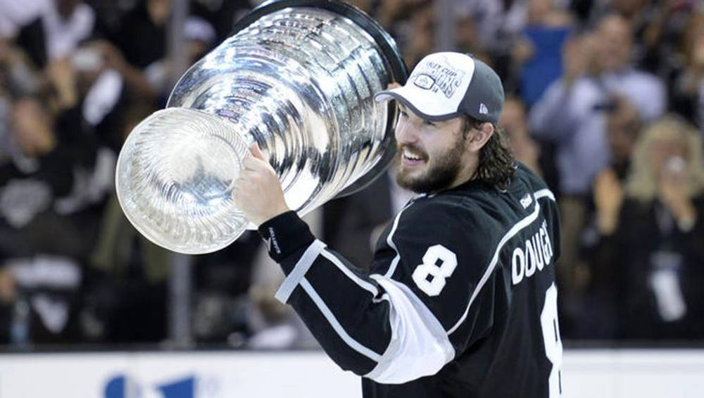Side View Of Drew Doughty Happily Holding The Stanley Cup Wallpaper
