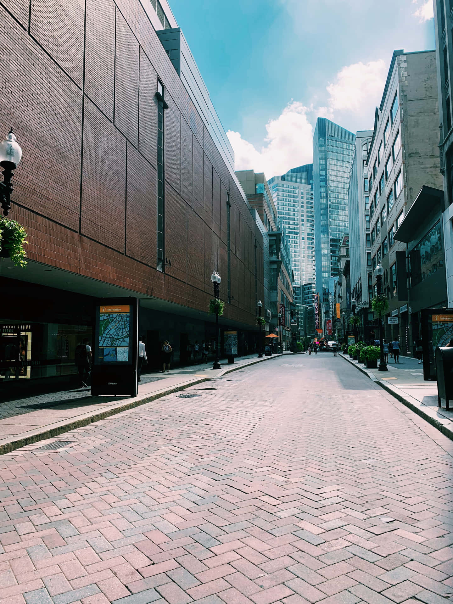Glistening pavement of a city sidewalk
