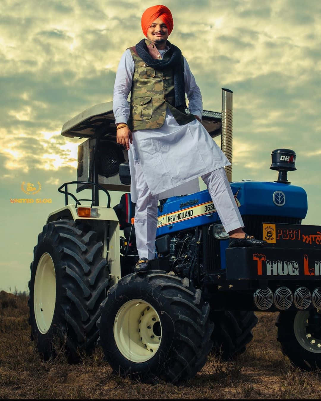 A Man Standing On A Tractor In The Field