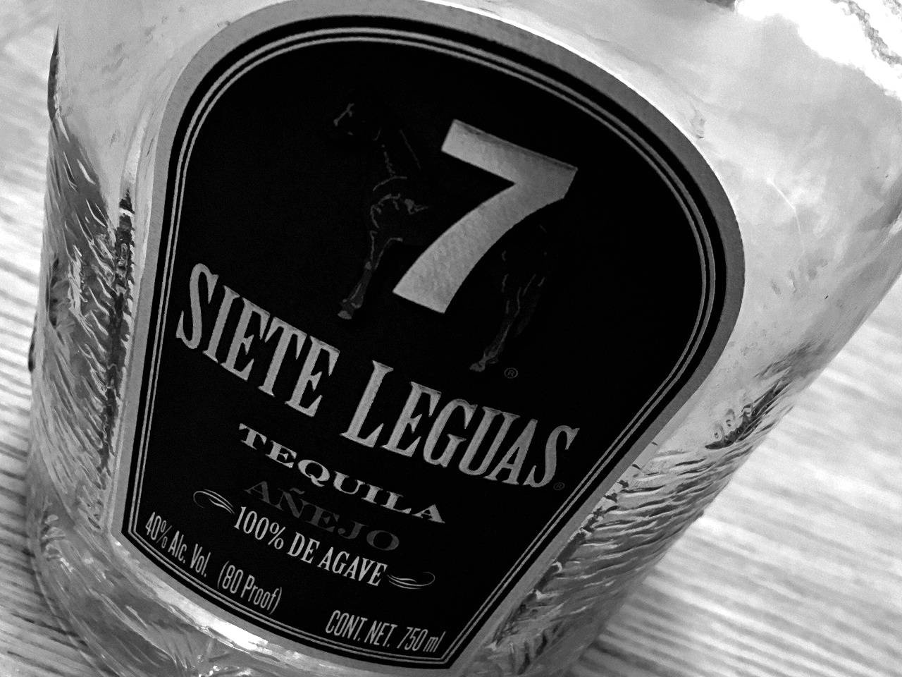 Caption: Sophisticated Siete Leguas Tequila Bottle in Monochrome Wallpaper