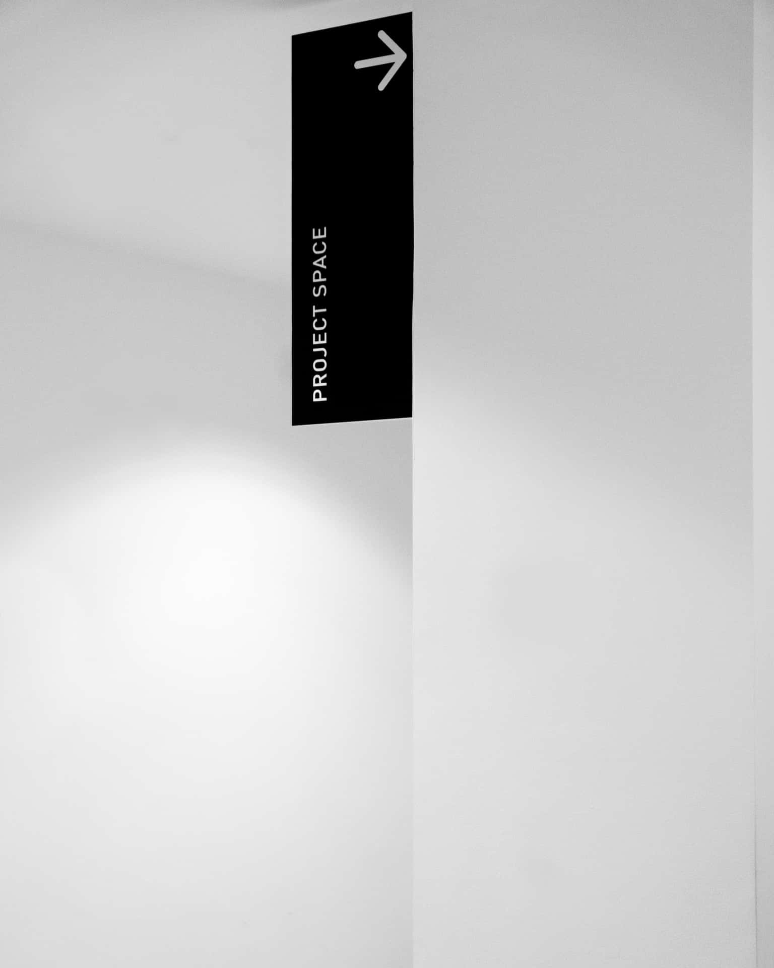 An Elegant Clean Signage Displayed On A Neat Brick Wall Wallpaper