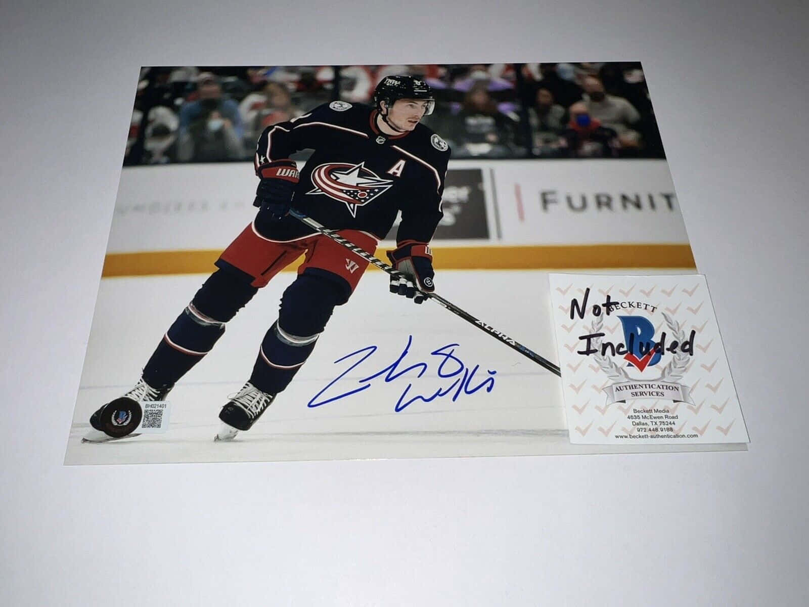 Signed Poster of Zachary Werenski on Wall Wallpaper
