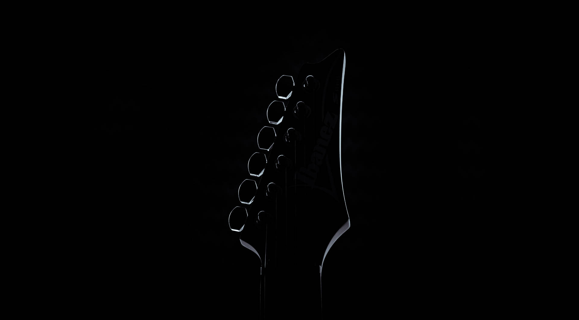 Exploring the World of Music with a Silhouette Guitar Wallpaper