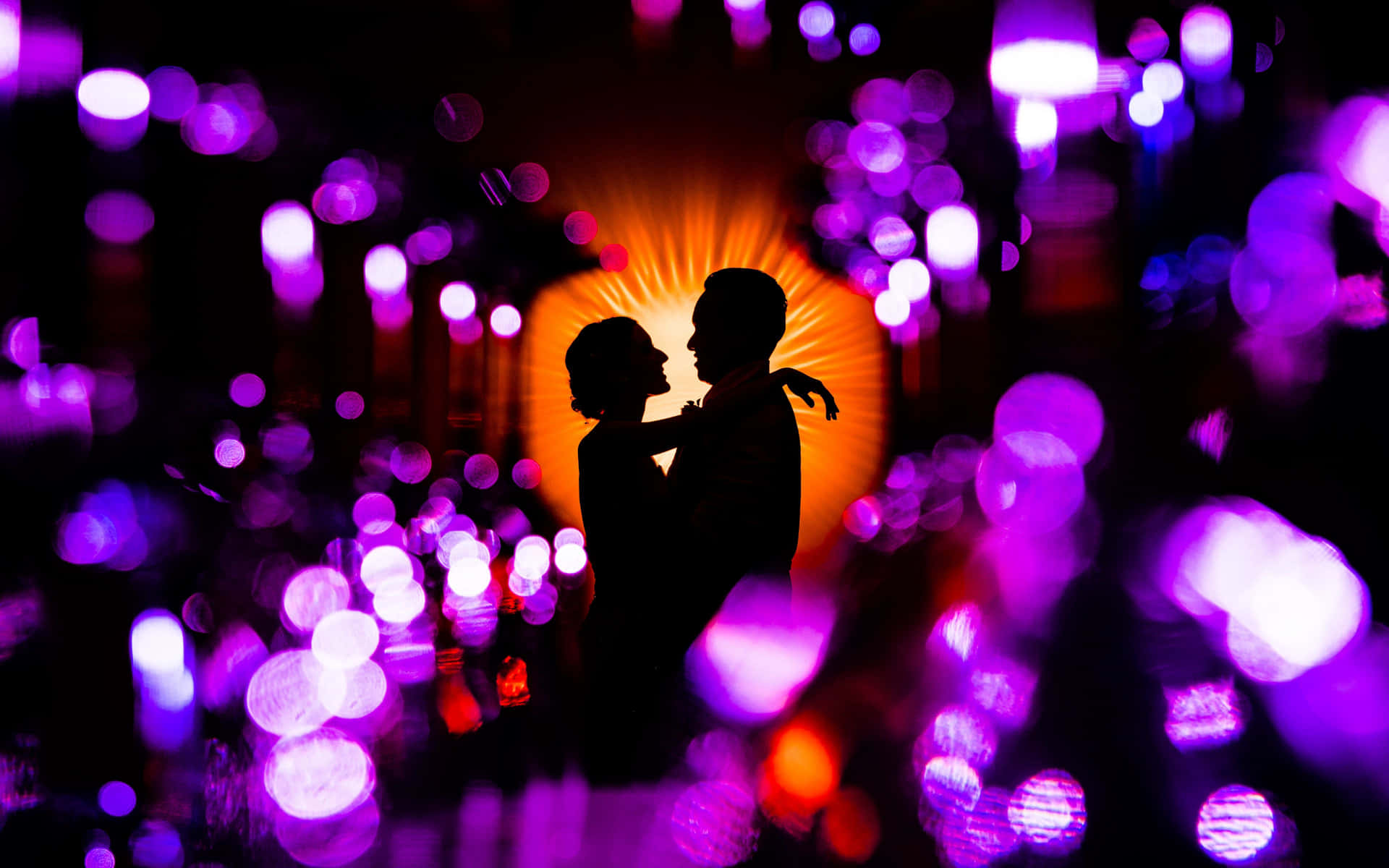 Silhouette Love Amidst Shimmering Lights PNG