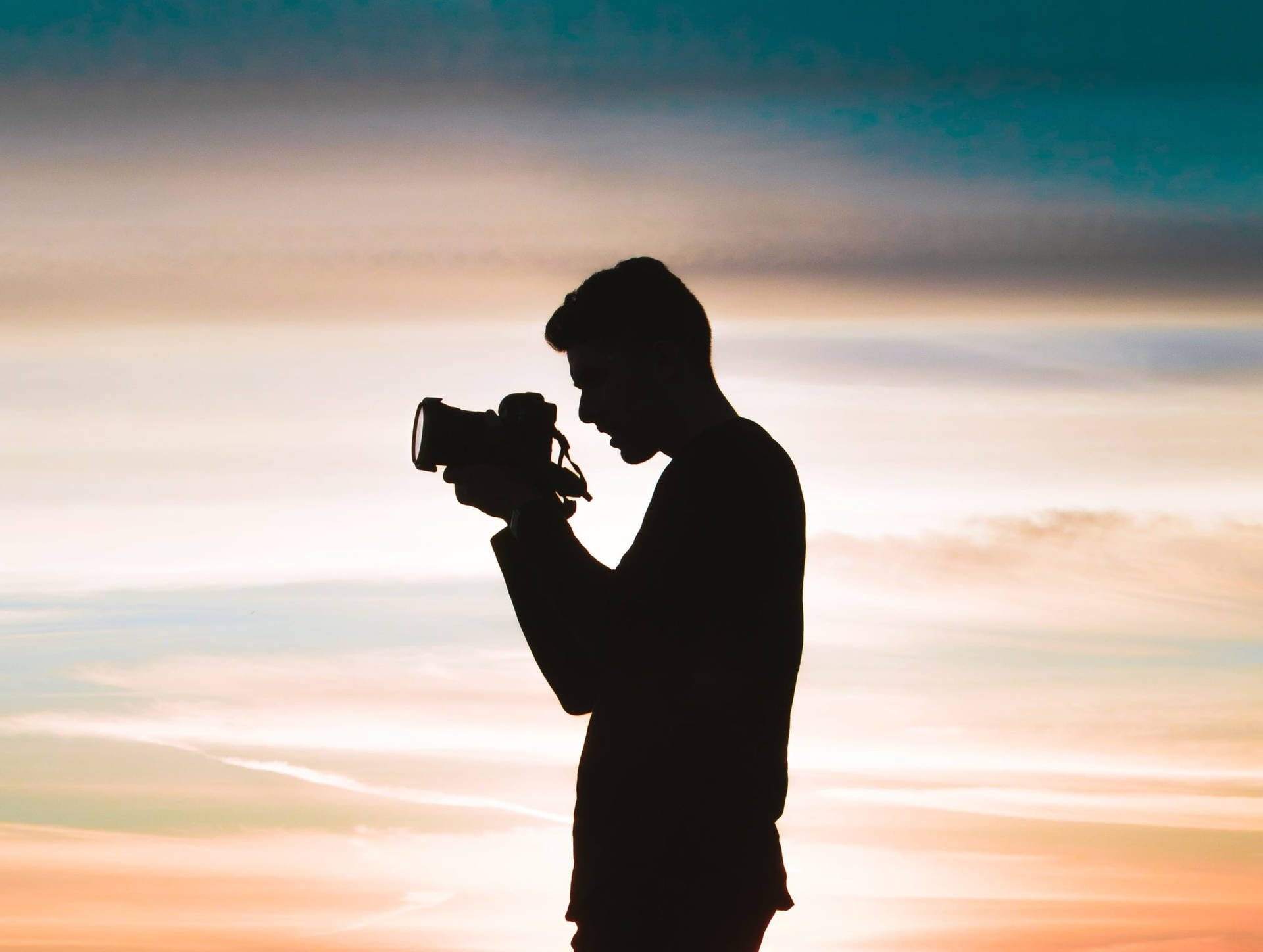 Silhouette Man With Camera Wallpaper