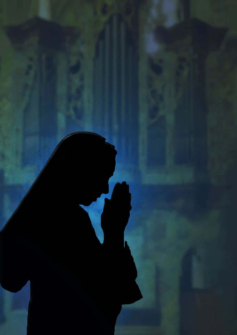 Silhouette Of A Nun Woman Praying Wallpaper