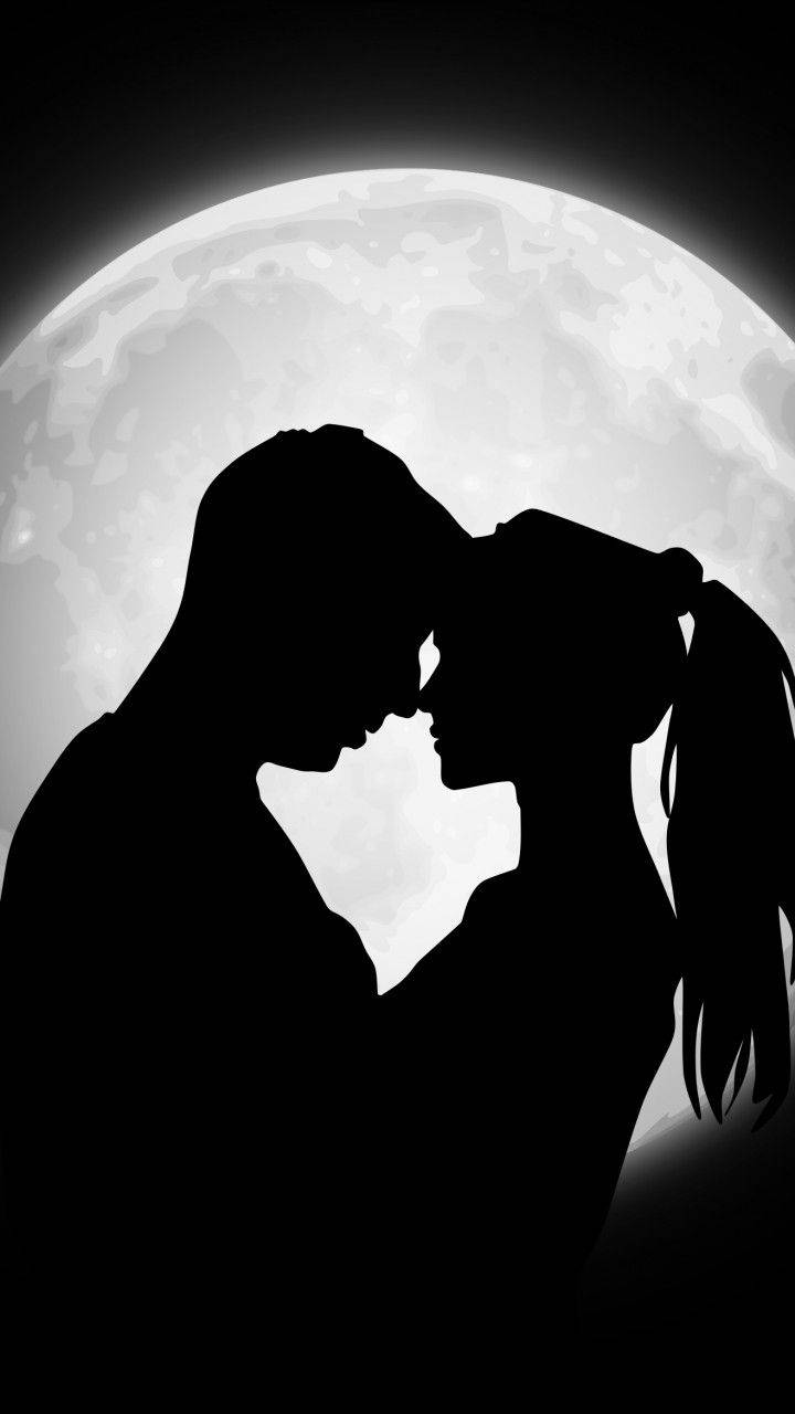 Silhouette Of Cute Couple In Moonlight