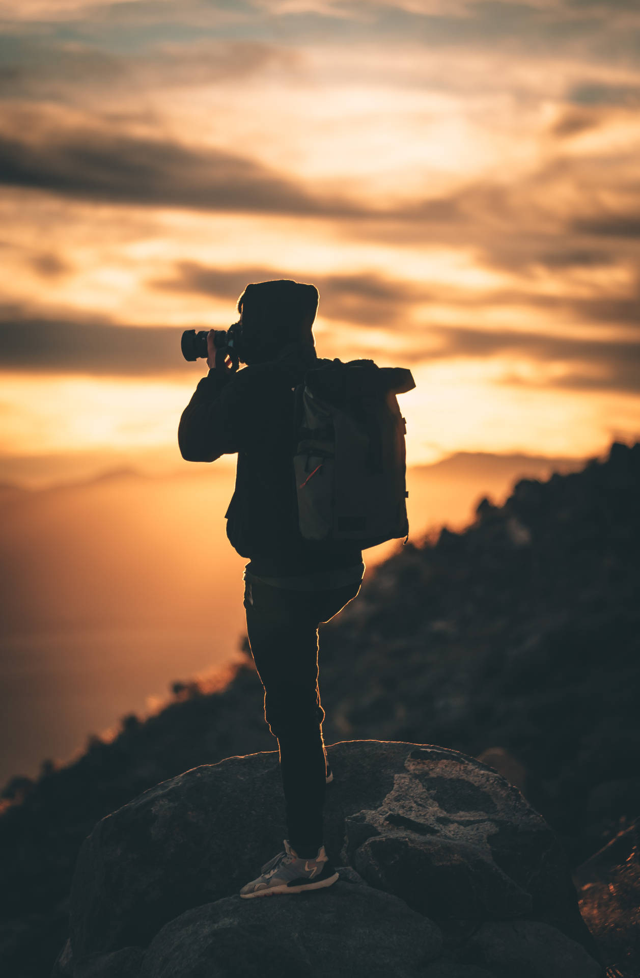 Silhouette Of Man Holding Camera During Sunset Photography